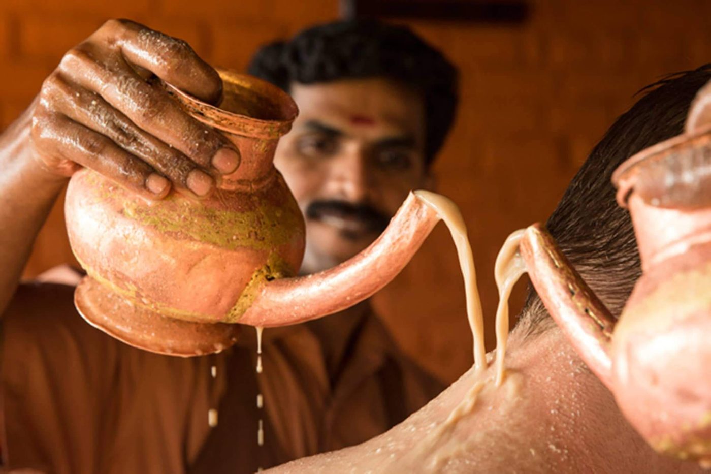 Kashaya Dhara Therapy Being Given By A Therapist At Somatheeram Ayurveda Village