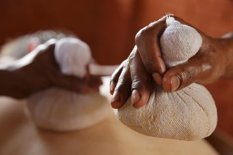 Herbal Kizhi Poultices Used In Treatment At Somatheeram Ayurveda Village