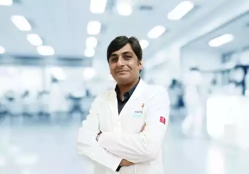 Dr. Anirudh S